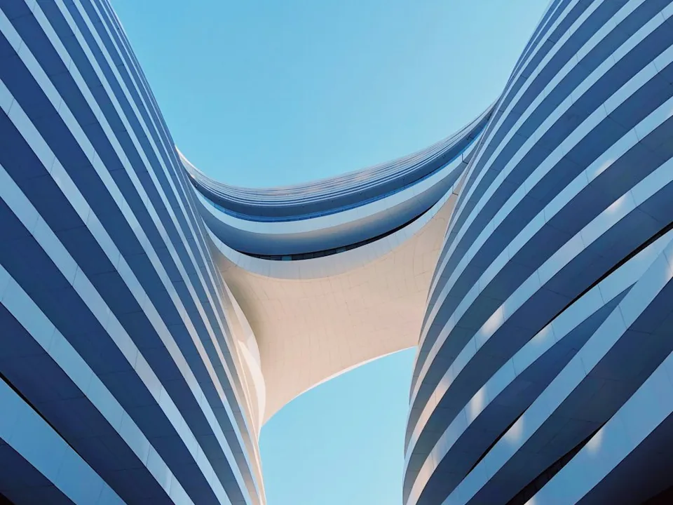 Glazed office tower looking up at the sky