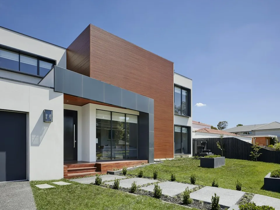 Modern glass villa photographed as a hospitality reference